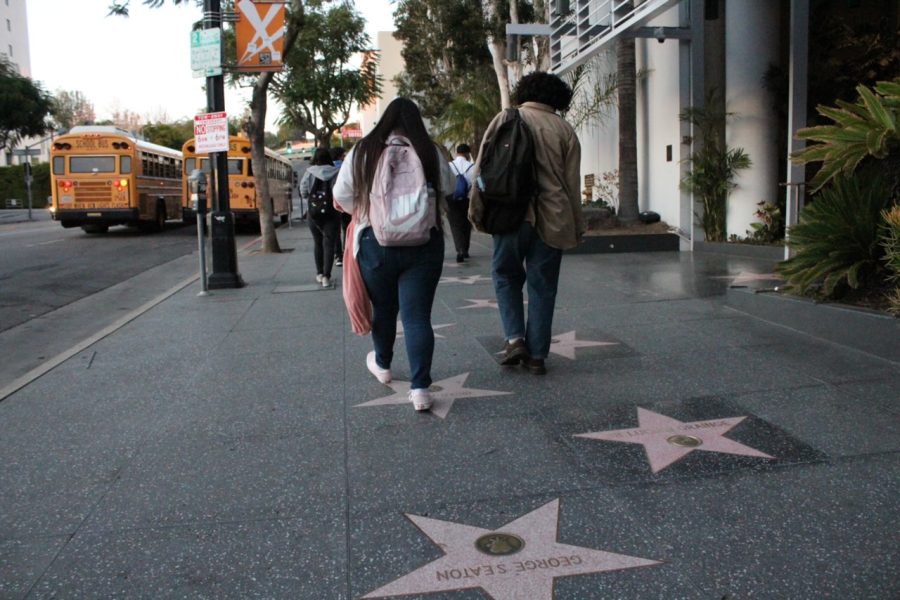 Students are on the walk of fame after watching Hamilton, the Broadway show. 