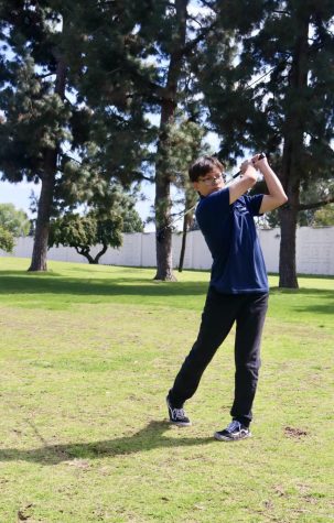Angel Javier Jaime Ludwin ches practices his swings before starting at hole 1