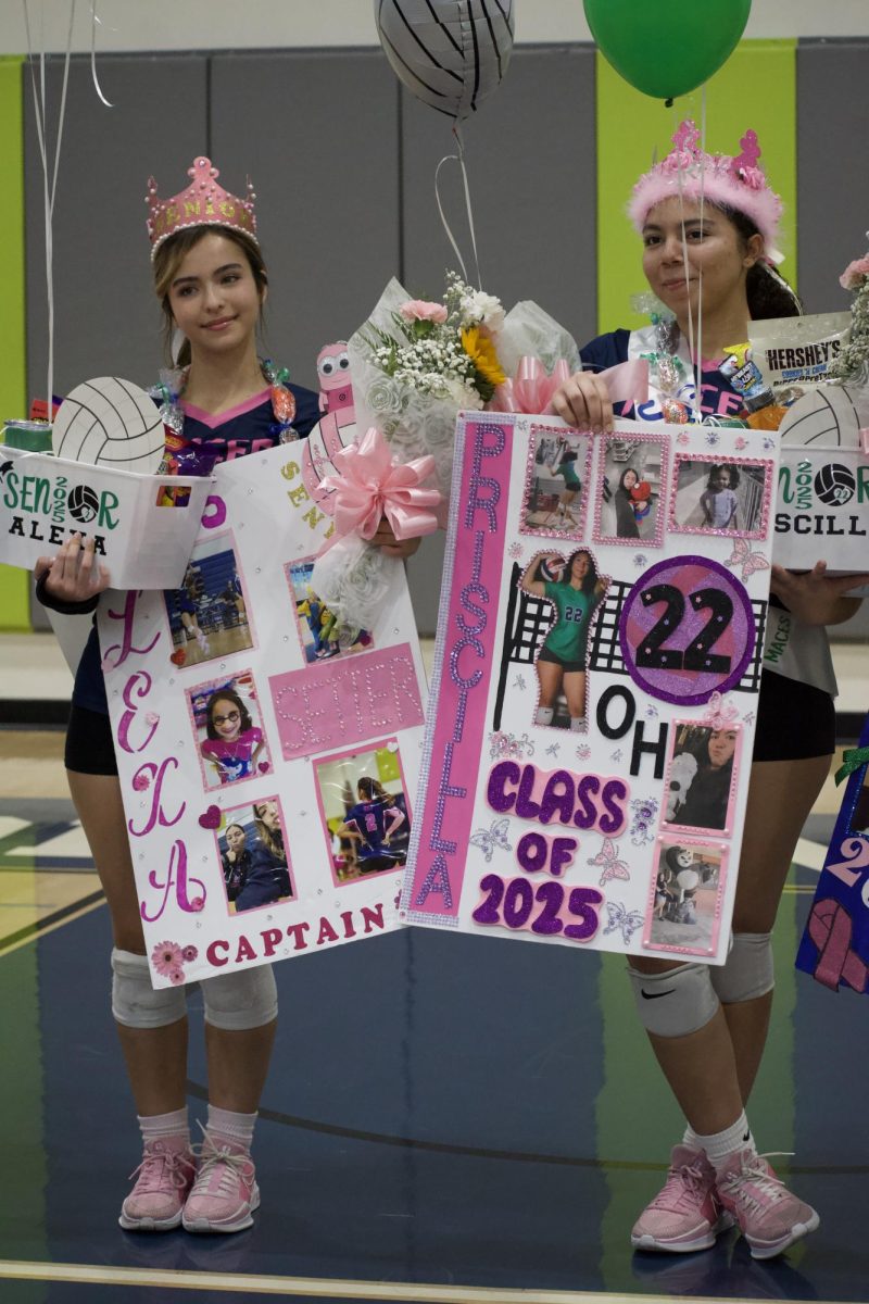 BITTERSWEET - Alexa Godoy [left] and Priscilla Anderson [right] sharing a bittersweet moment as they pose for a picture on their senior night. On Monday, October 21 the Wolfpack girl’s volleyball team won their match against Bravo Medical High school by a score of 3-0. Many of their friends and family came to celebrate their victory against Bravo and their senior night. Their teammates gifted them personalized posters, baskets, paper crowns, and flowers after their game to celebrate all they’ve contributed to the team throughout the past years.