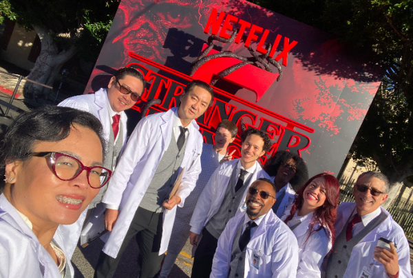 Taking part- Actors dressed as scientists preparing behind the scenes for the stranger things experience with Ashley Melendez's cousin, second from right.
