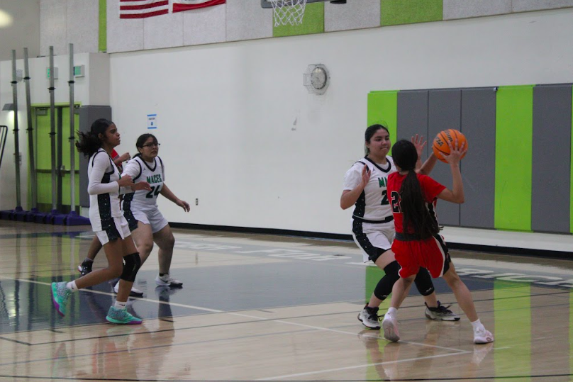  Ladypack Players; Karye Hernandez, Evelyn Lopez, and Samantha Ortiz protect their homecourt against Torres.  