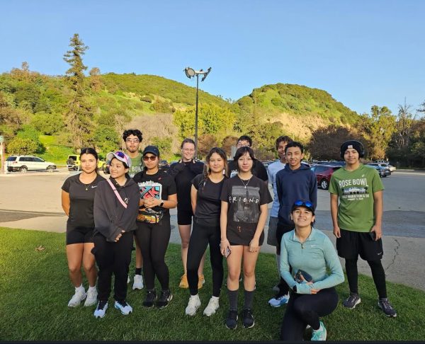 Members of the MACES Students Run L.A. team are seen gathered at Griffith Park after a practice session ahead of the Los Angeles Marathon. The group, which includes participants from 9th-12th grades, spent months training and building endurance in preparation for the 26.2 mile race. “Crossing the finish line was surreal because of all the work you put through since September,” said runner Ethan Liera, reflecting on the team’s experience in the race. 