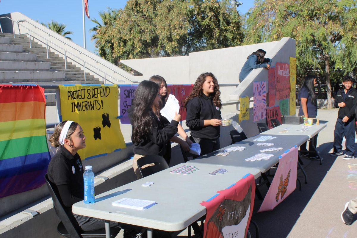 The fight for social justicebegins with taking action, speading out the word, and utilizing student voice to influence others todo the same. During a lunch event, the R&R Club set up an informational booth to celebrate and inform about Human Rights Day. These young members utilized their pride and spirts to express their voice and giving out pins. 
